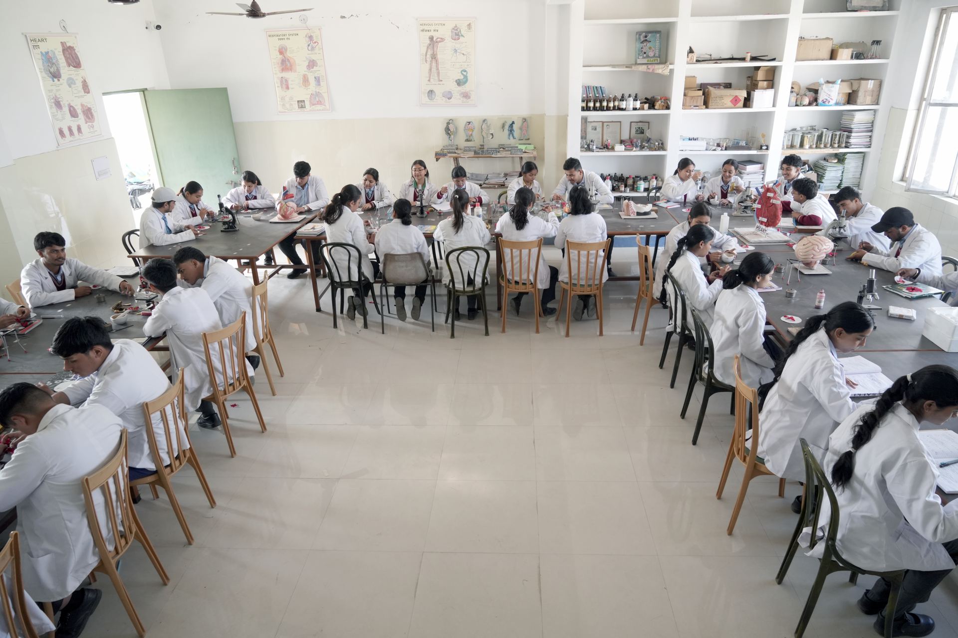 Students performing chemistry practicals in the laboratory